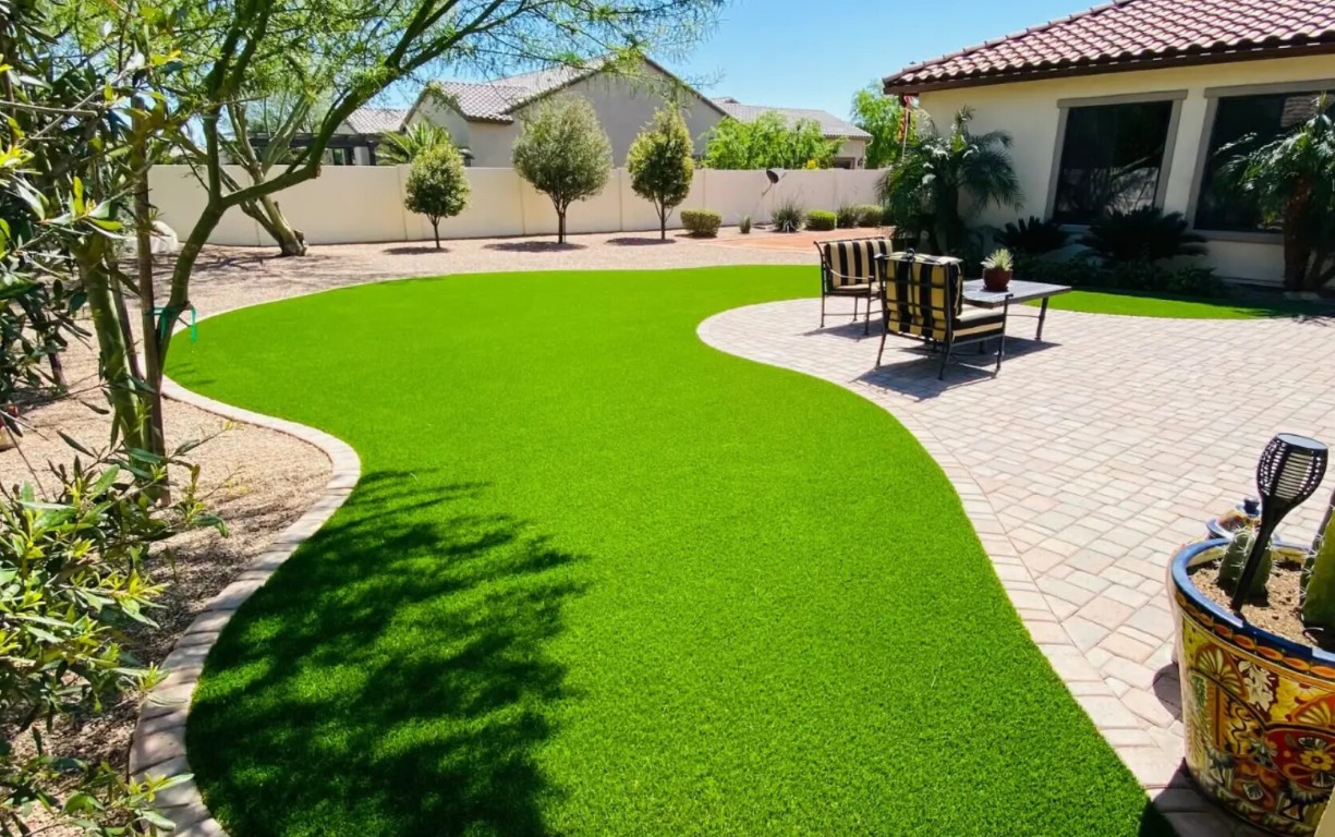 Professional artificial grass installation in Poinciana backyard